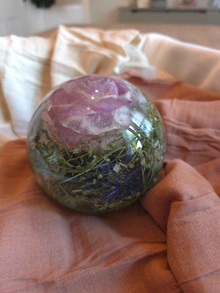 Floral preservation large sphere preserving flowers such as pink roses, thistles, white roses, sea thrift, and greenery. Book now to preserve your special wedding keepsake or special occasion heirloom now!